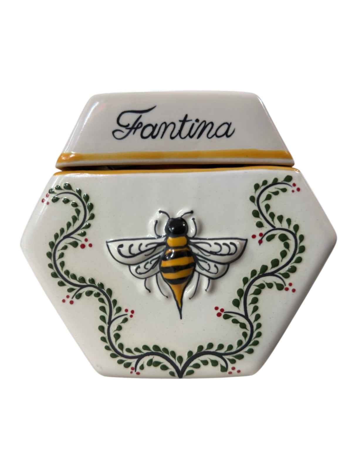 The bee in relief and the speckled glaze of the Enredadera vessel, hand-painted in Santa María Canchesdá, Mexico.